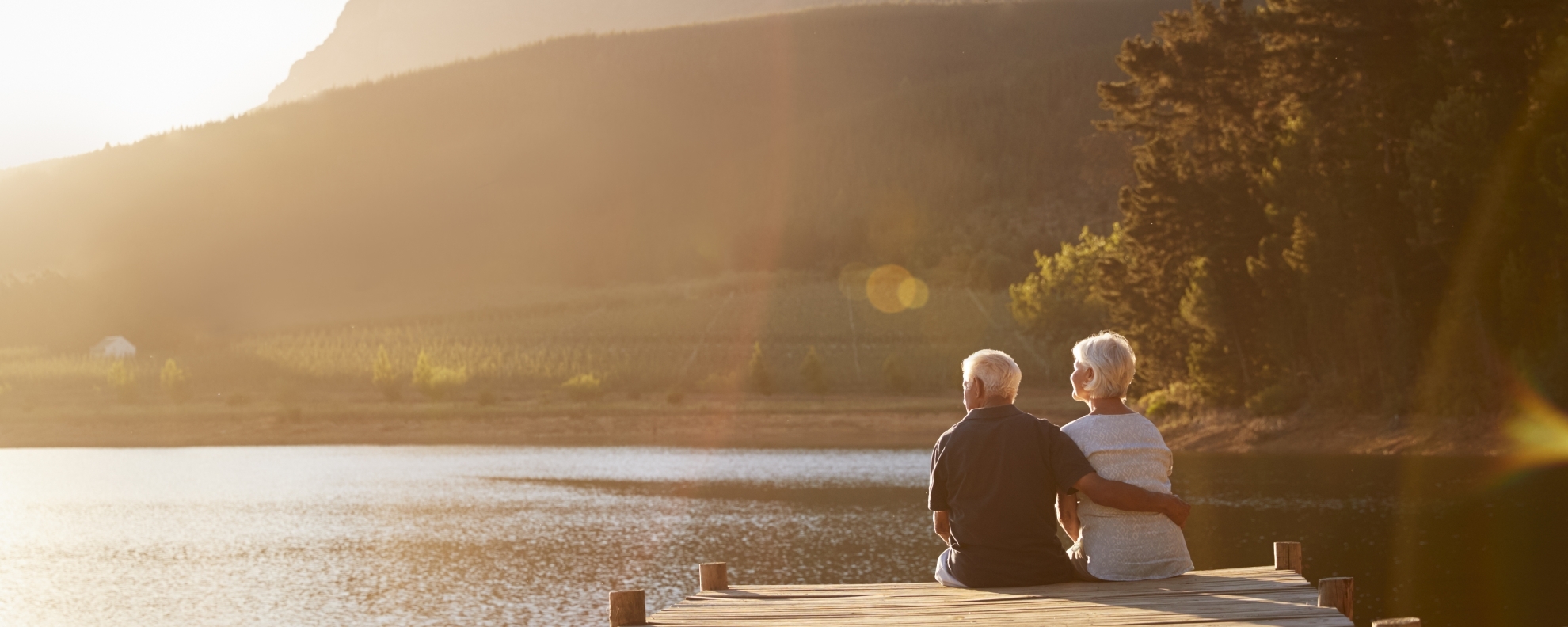 Mature Couple Sitting On Dock